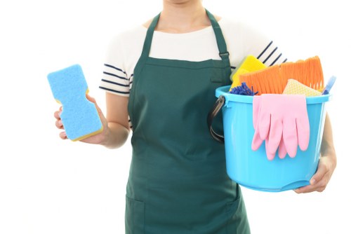 Cleaner preparing carpet cleaning equipment before a service visit